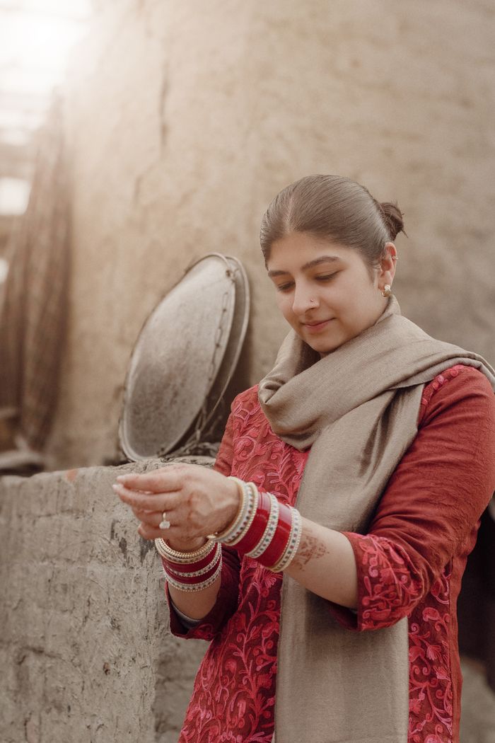 Portrait of a South Asian woman wearing traditional bangles in Punjab, India.